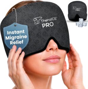 A woman wears a black TheraICE PRO migraine relief mask over her eyes and forehead. A tag on the mask reads Instant Migraine Relief. Ice cubes and a folded mask are shown in the background—one of the top Amazon wellness finds.
