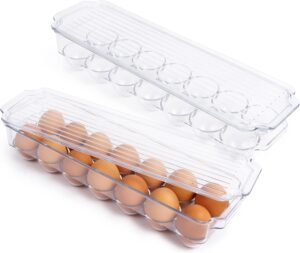 A clear plastic egg holder with a lid, containing a row of brown eggs. The lid is partially removed, revealing the eggs inside. The container has spaces for a dozen eggs and is set against a white background.