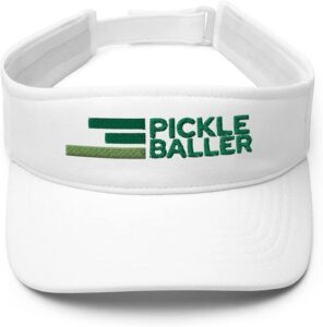 A white sports visor with green embroidered text that reads PICKLE BALLER and a stylized graphic of three horizontal green lines on the front.