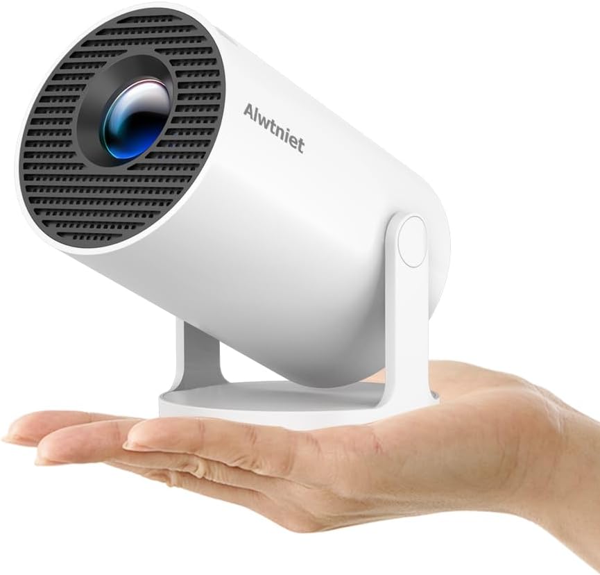 A white portable projector with Alwtniet branding rests on an open human hand, illustrating its compact size. The cylindrical projector is perfect for showing off fashion items for teens, with a forward-facing lens for vivid displays.