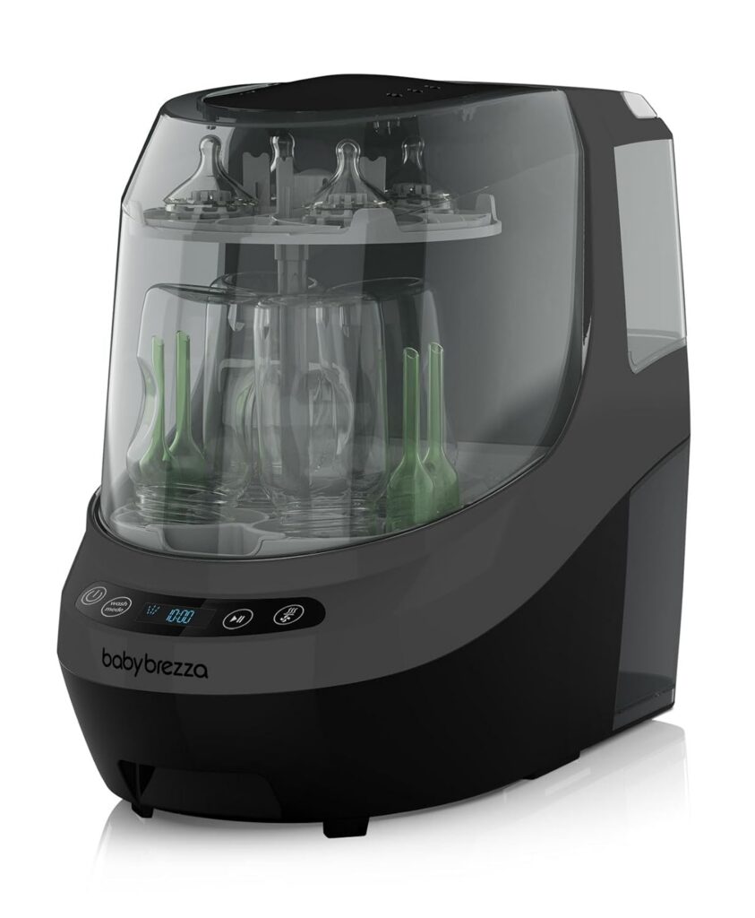 A black Baby Brezza baby bottle sterilizer and dryer with a transparent lid, showing baby bottles and nipples arranged inside on two shelves. The front panel displays touch controls and a digital screen.