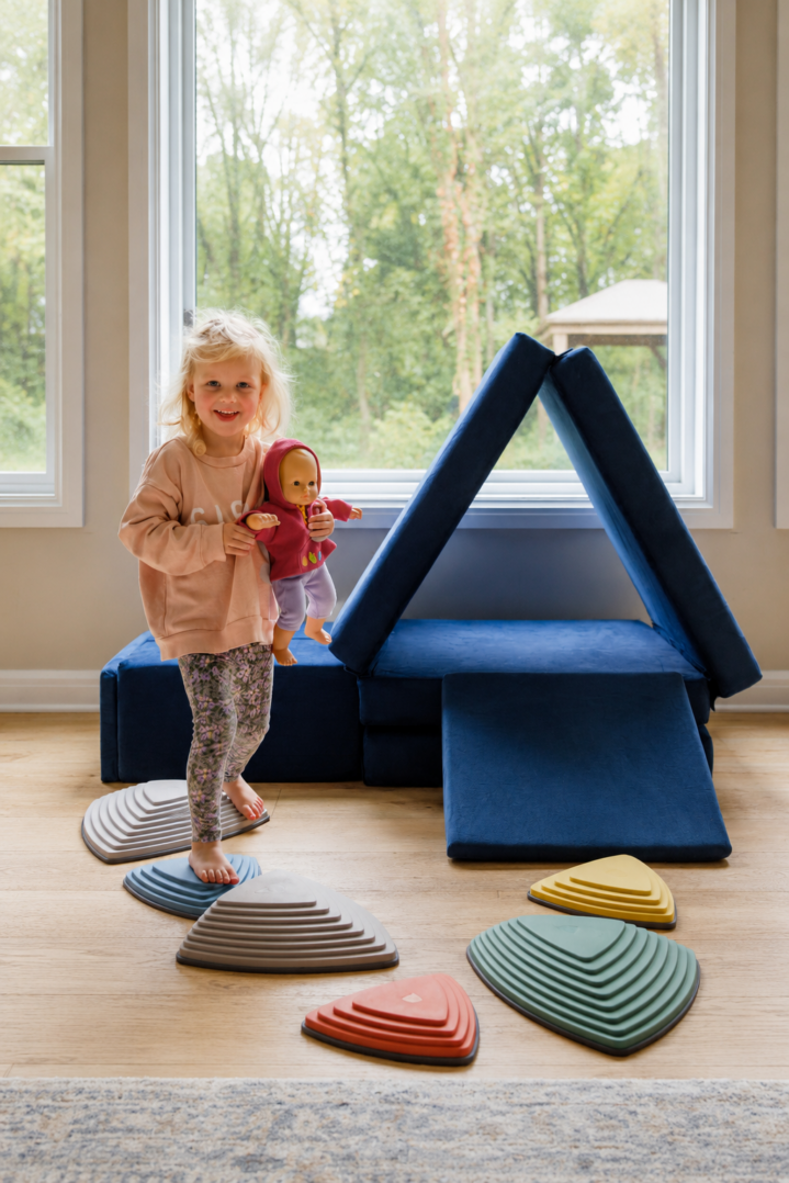 Child building with Figgy Play Couch