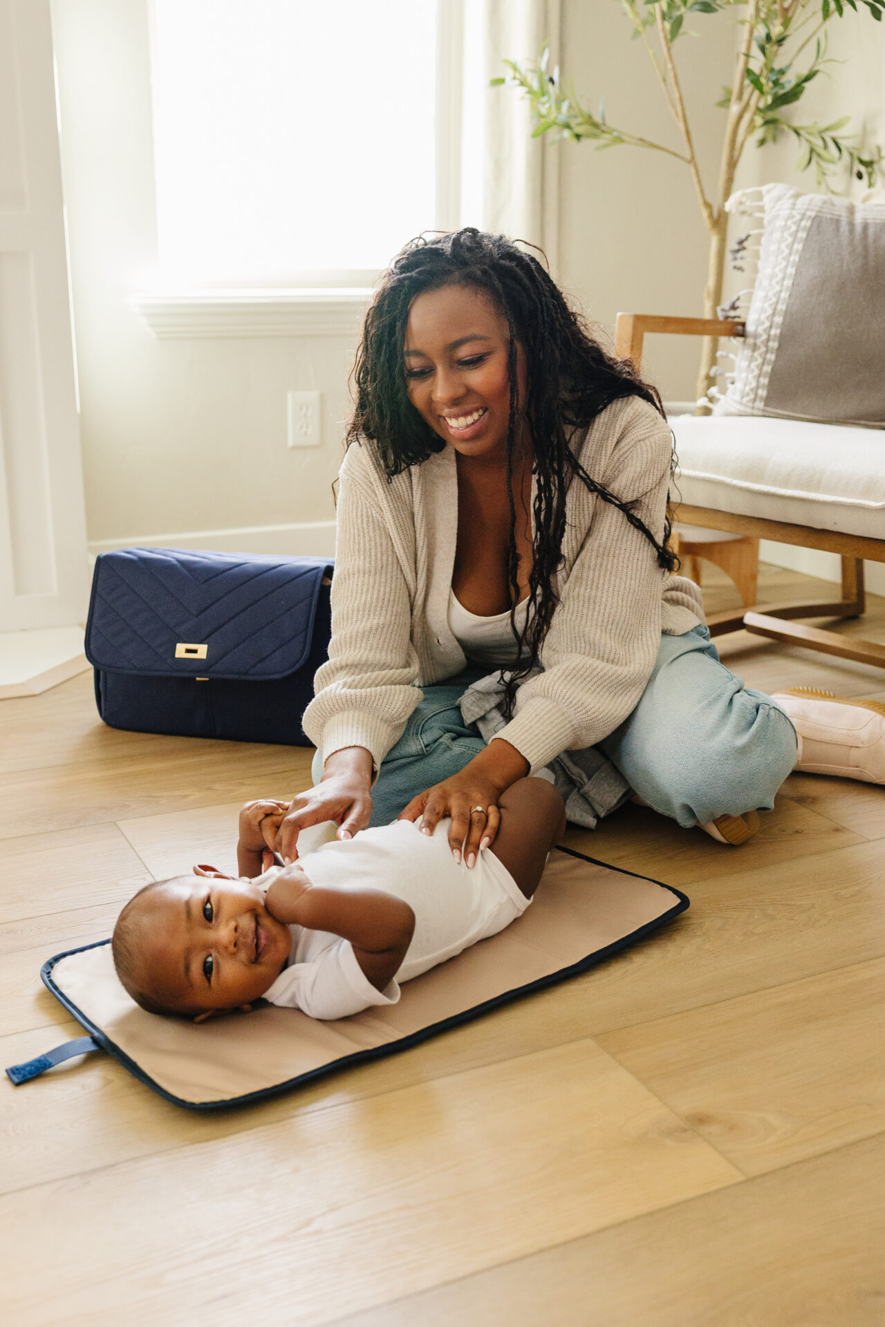 August & Ivy IvyGo Diaper Bag being carried